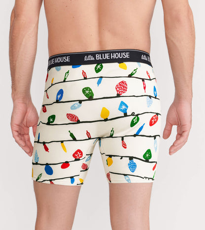Men's boxer briefs featuring a festive pattern of colorful Christmas lights on a cream background, shown from the back.