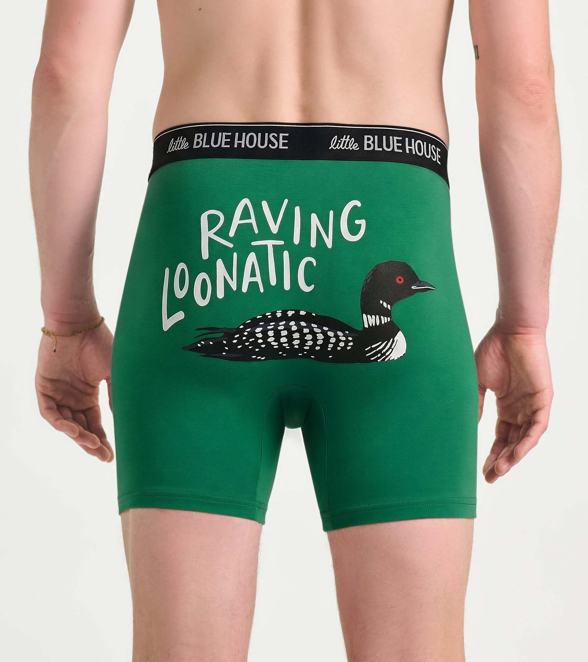 Back view of green boxer briefs with black waistband and loon graphic with “RAVING LOONATIC” text