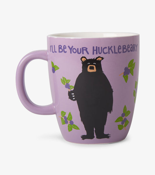 Lavender ceramic mug with handle, black bear and blueberry design, and “I’ll Be Your Hucklebeary” text