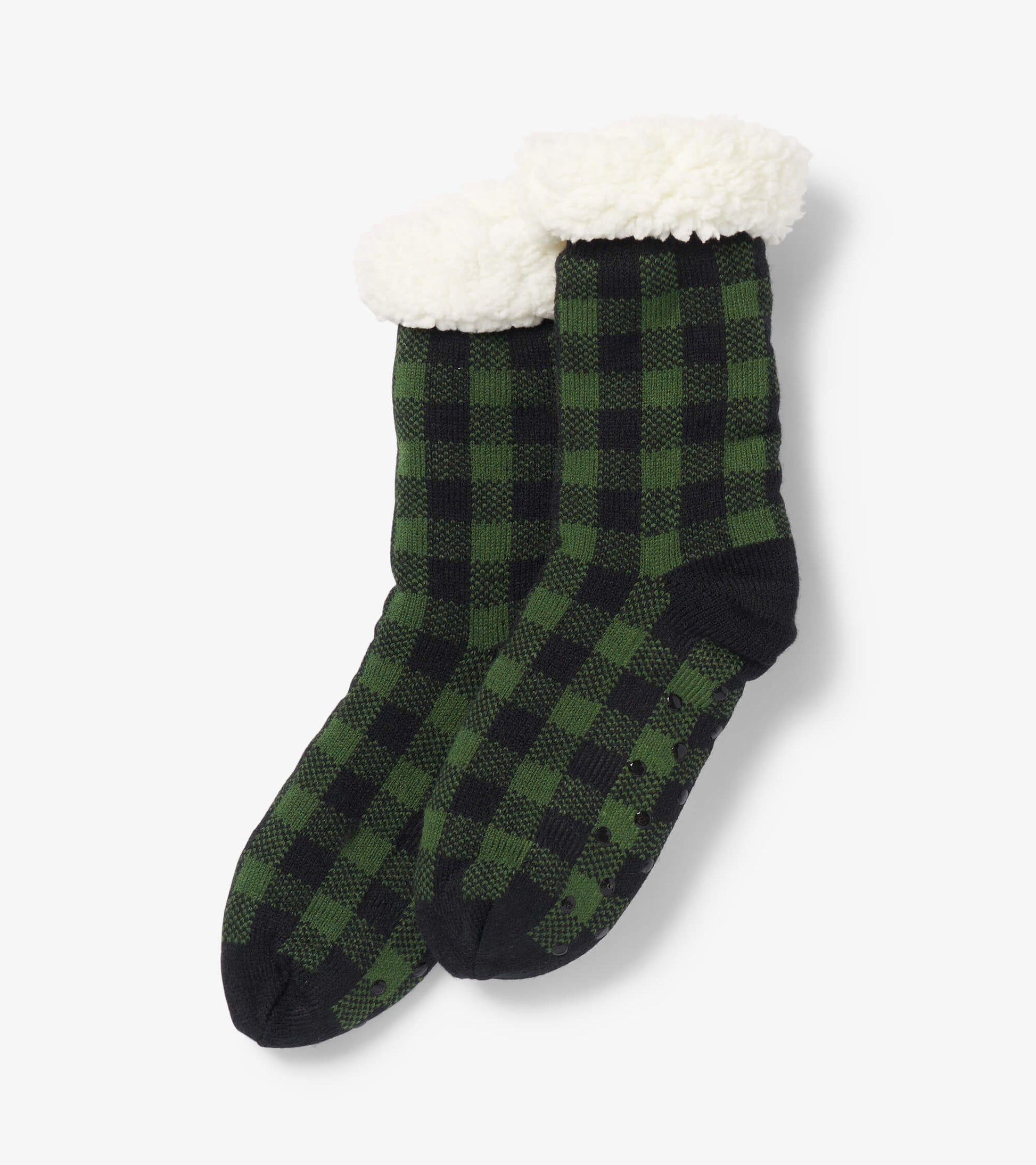 Forest green and black plaid women's cabin socks with a cozy white Sherpa lining at the cuff.