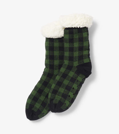 Forest green and black plaid women's cabin socks with a cozy white Sherpa lining at the cuff.