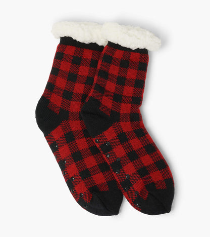 Red and black buffalo plaid sherpa-lined cabin socks with white fluffy cuffs and grippy soles
