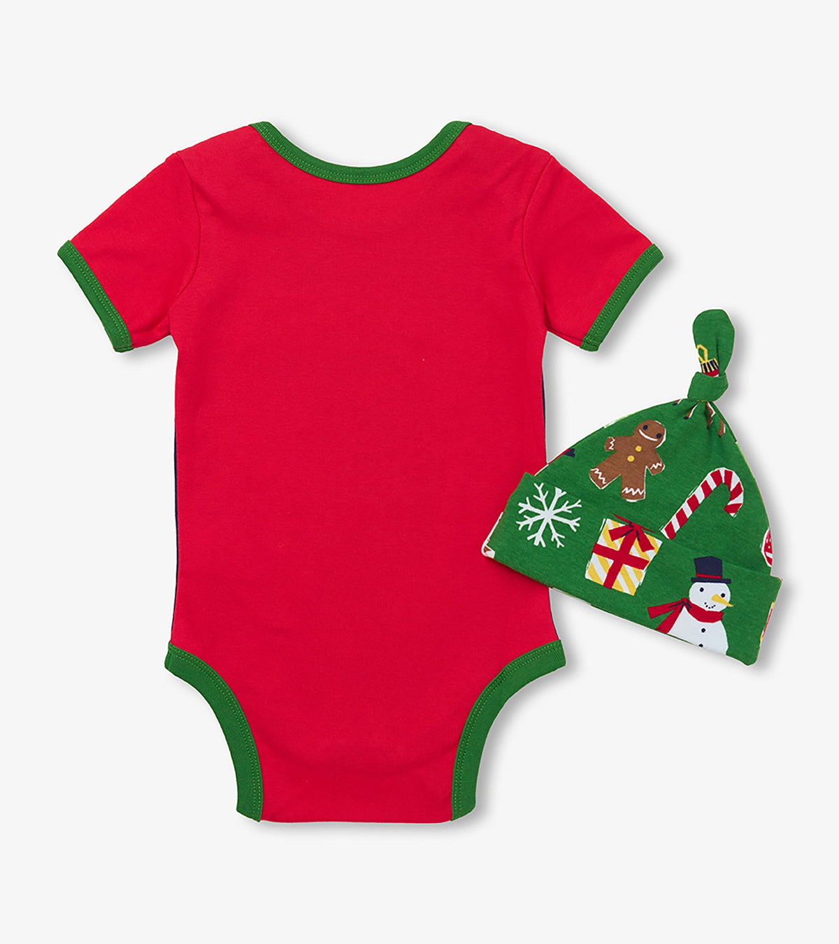 Back of red baby bodysuit with green trim and matching green holiday print hat