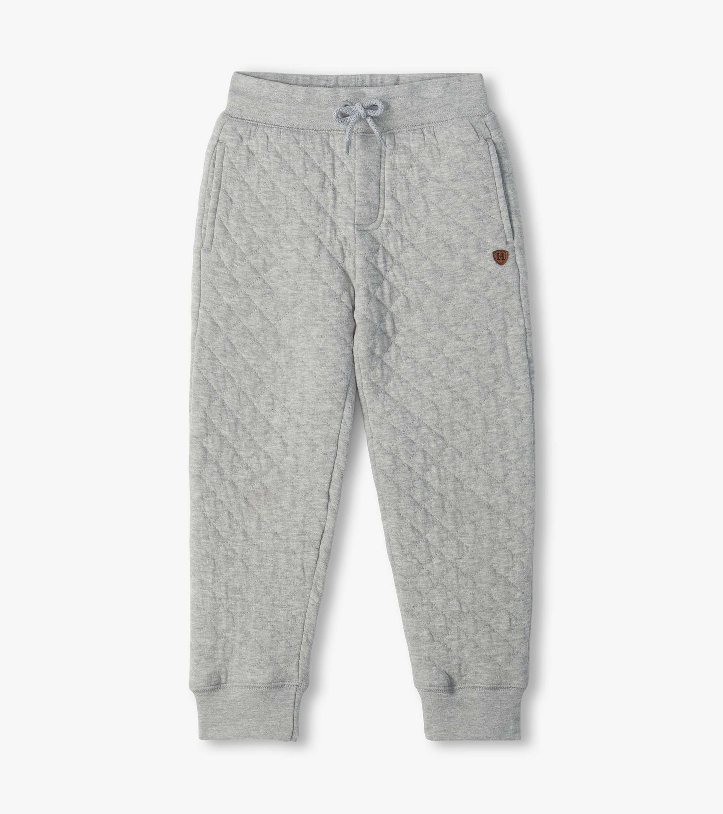 Athletic grey quilted jogger pants with drawstring waist, side pockets, and ribbed ankle cuffs