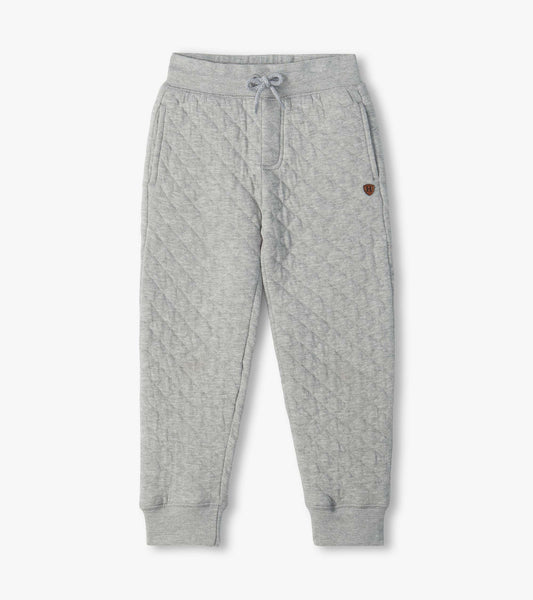 Athletic grey quilted jogger pants with drawstring waist, side pockets, and ribbed ankle cuffs