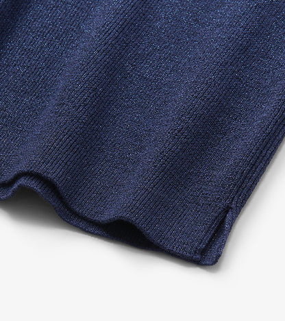 Close-up of patriot blue glitter knit with ribbed texture and scalloped hem detail