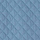 Blue quilted diamond-patterned fabric texture