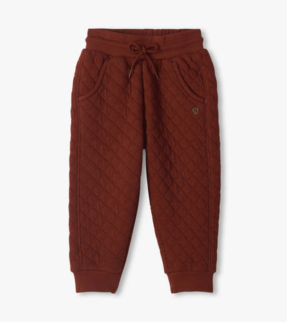 Front view of madder brown quilted joggers with drawcord waist, slash pockets, and ribbed cuffs