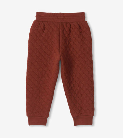 Back view of madder brown quilted joggers with tapered legs and ribbed cuffs