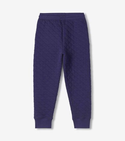 Back view of boys patriot blue quilted joggers with tapered legs and ribbed cuffs