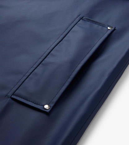 Close-up of patriot blue rain jacket front flap pocket with silver snap corners