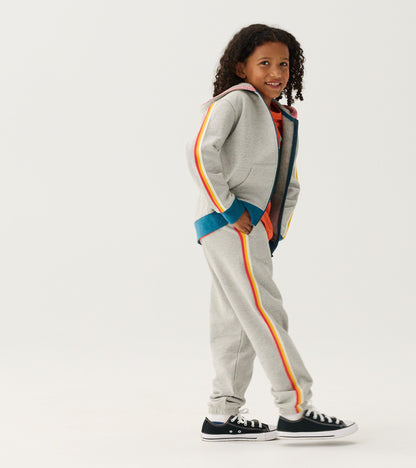 Grey baggy track pants with colorful side stripes, designed for boys, featuring an elastic waistband and cuffs.