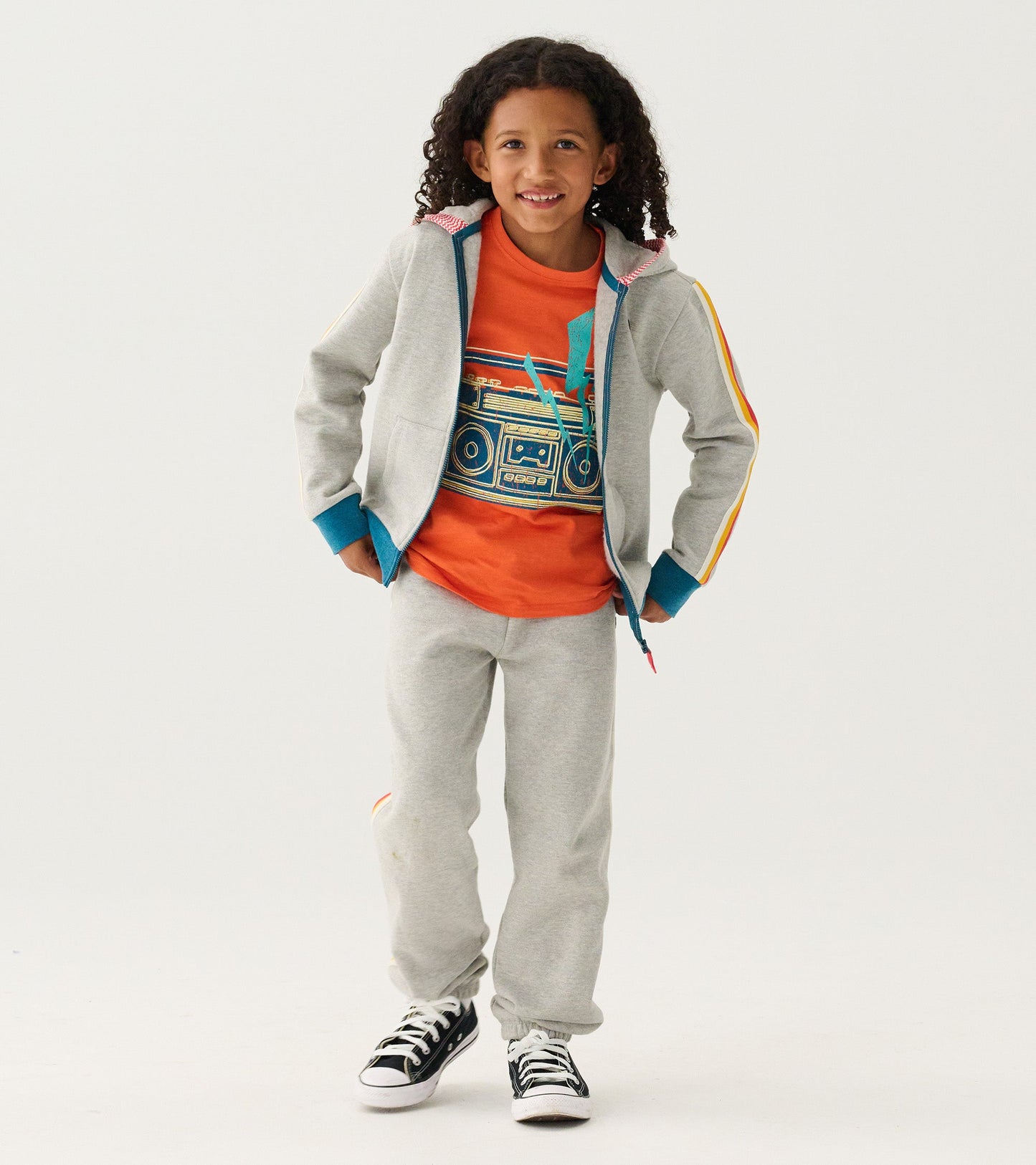 Grey baggy track pants made of soft material, designed for boys, featuring a relaxed fit for athletic wear.