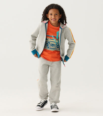 Grey baggy track pants made of soft material, designed for boys, featuring a relaxed fit for athletic wear.