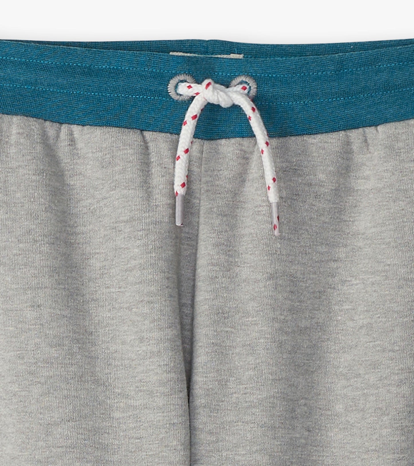 Grey baggy track pants featuring a teal waistband and white drawstring with red accents. Ideal for athletic wear.