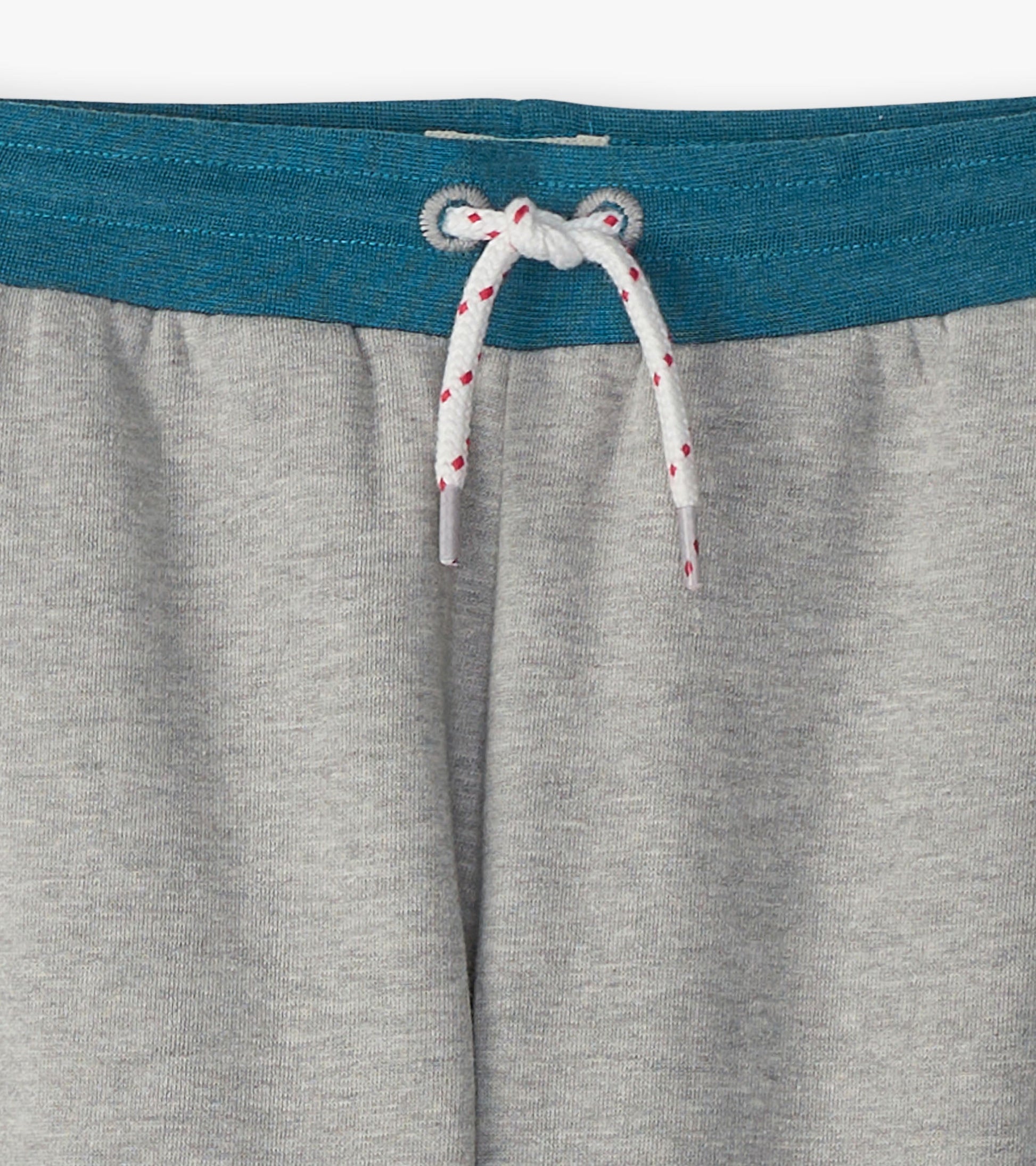 Grey baggy track pants featuring a teal waistband and white drawstring with red accents. Ideal for athletic wear.