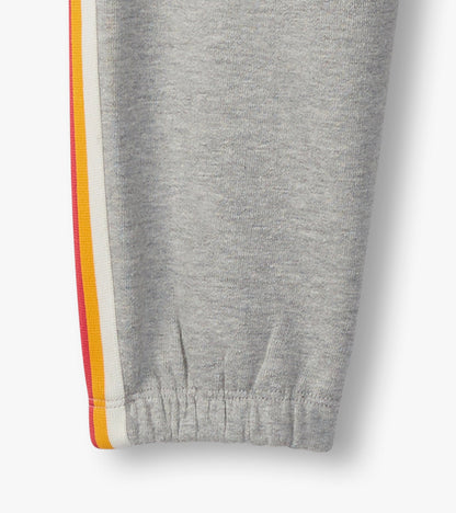 Grey baggy track pants featuring colorful side stripes and elastic cuffs, ideal for athletic wear.