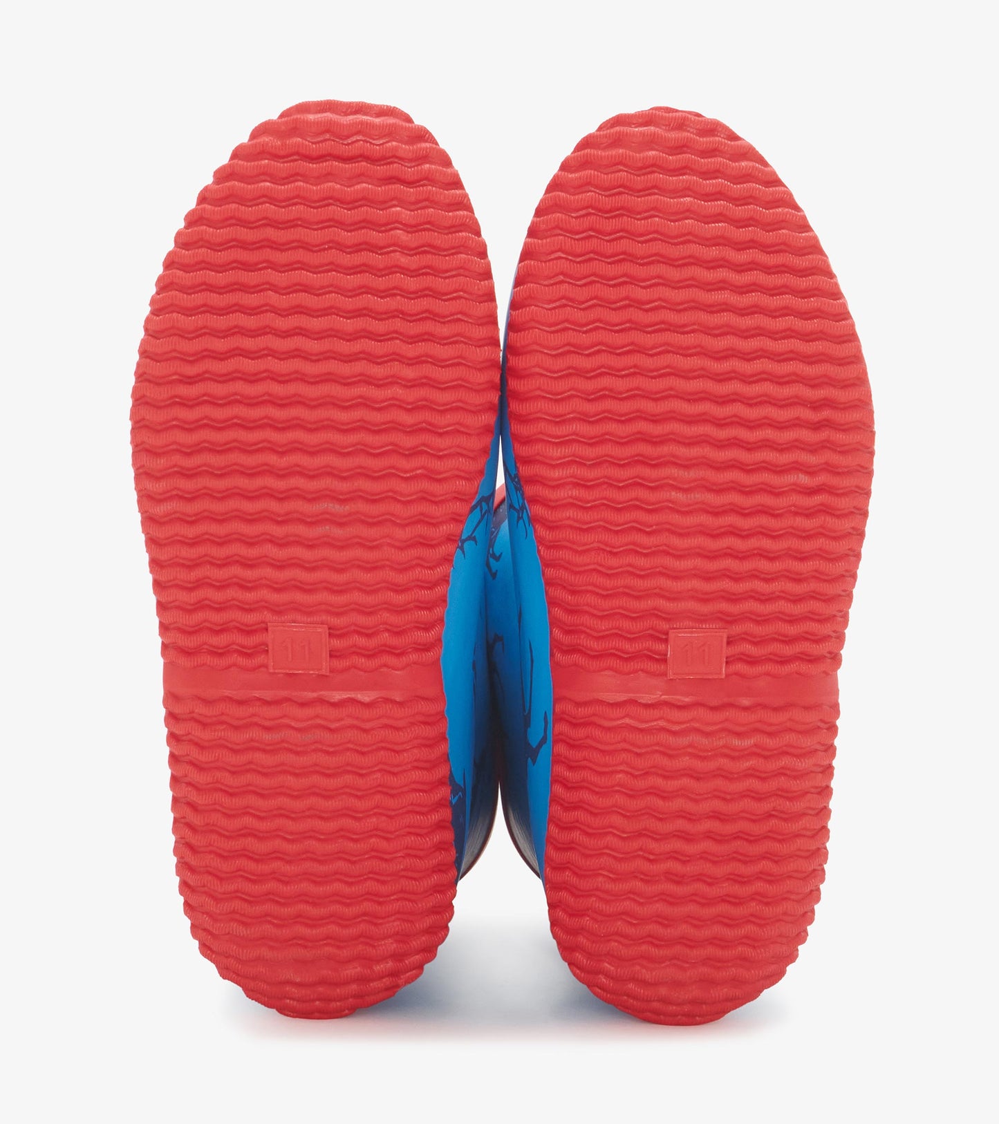 Blue packable rain boots with a textured red sole, designed for boys, featuring a playful pattern.