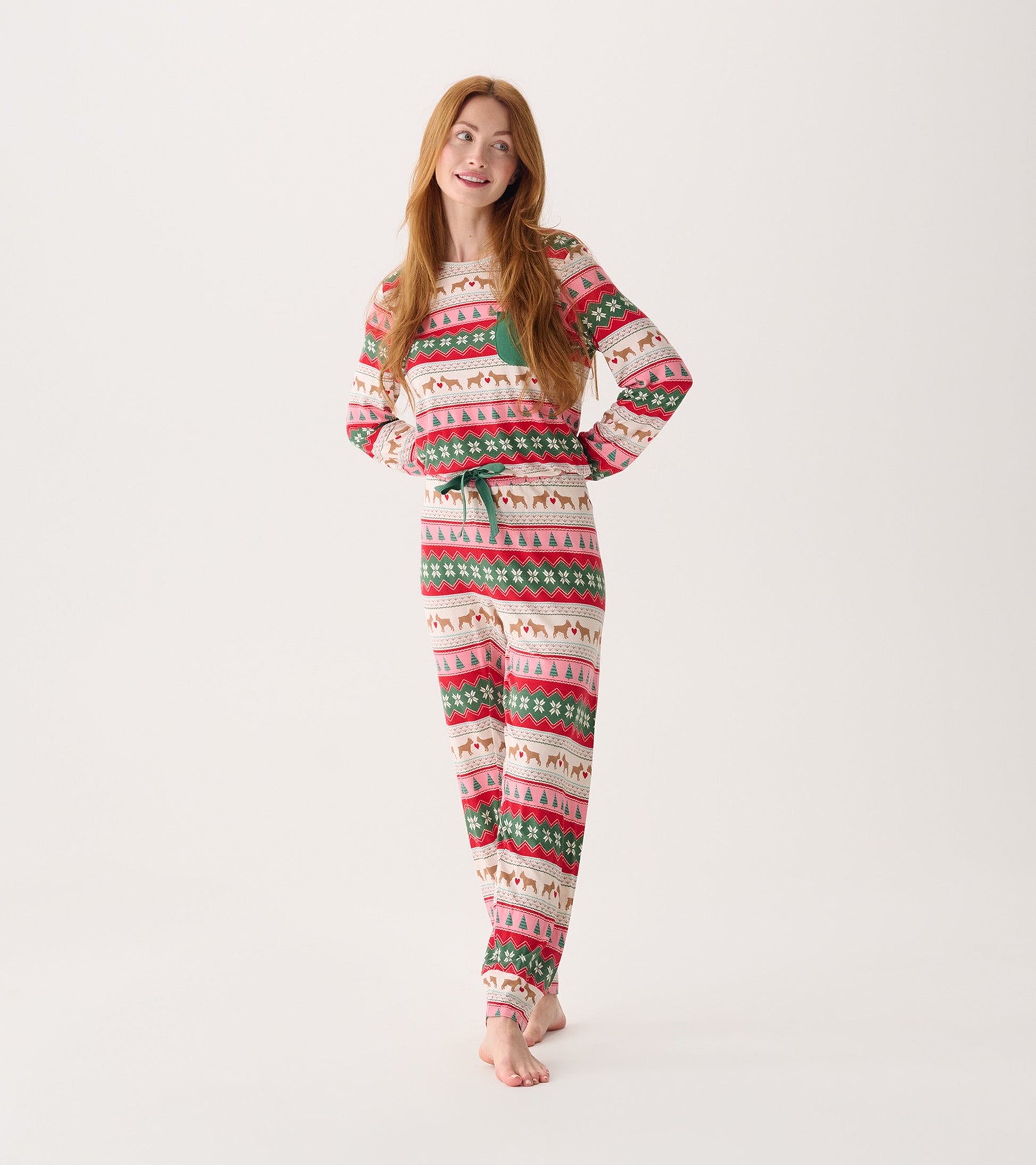 Long-sleeve pajama set in cream with a festive puppy hearts Fairisle pattern in red, green, and pink.