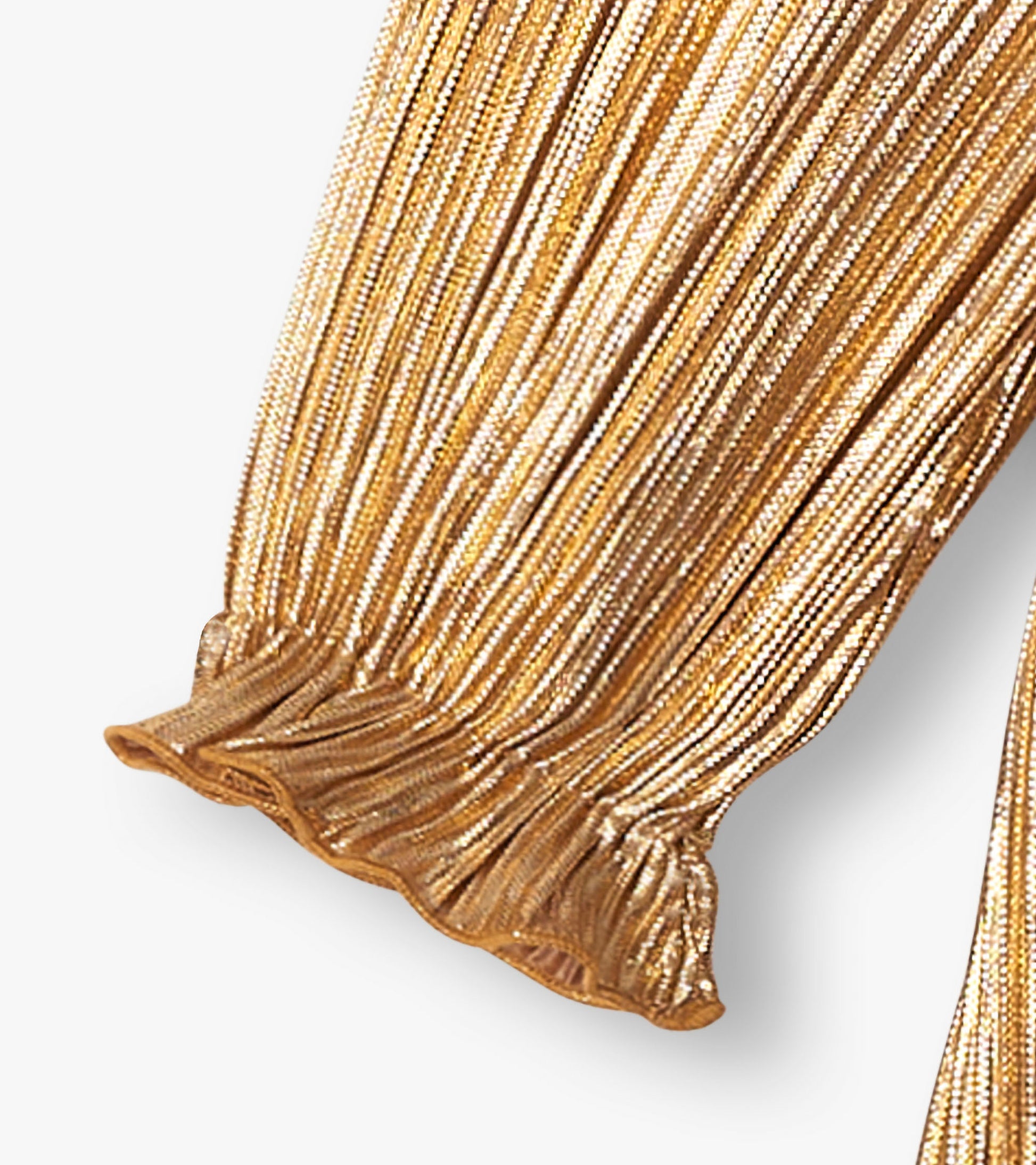 Close-up of gold metallic pleated sleeve with gathered ruffle cuff