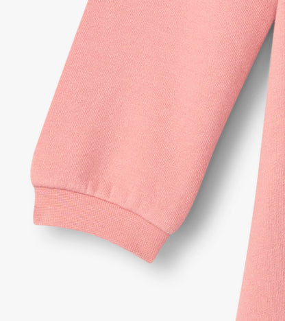 Light pink cozy dress with long sleeves, featuring a soft fabric and ribbed cuffs, ideal for baby and toddler girls.