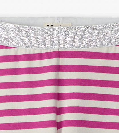 Pink and white striped leggings with a shiny silver waistband, suitable for casual wear.