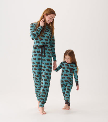 Bamboo pajama set featuring a teal color with black bear patterns, worn by a woman and a girl, both barefoot.