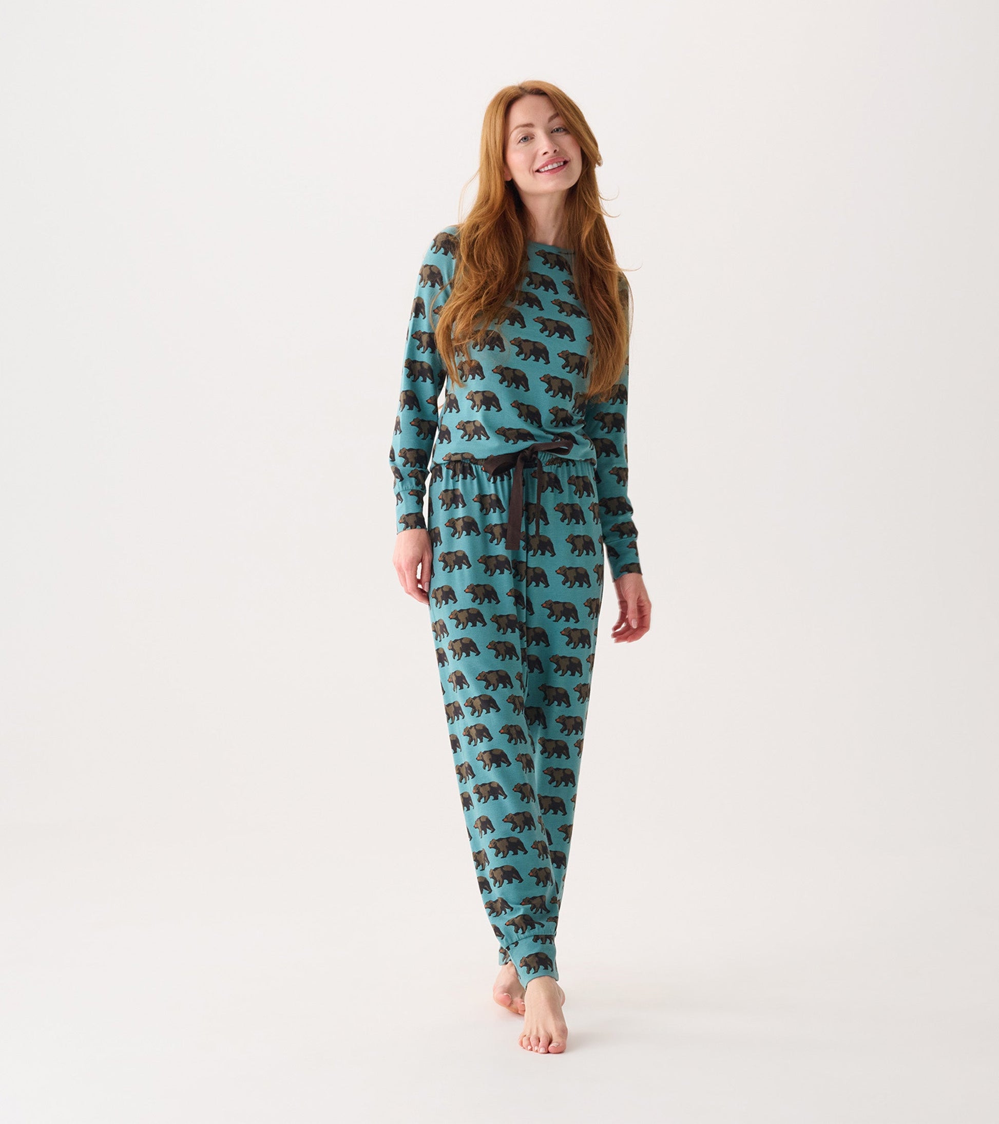 Bamboo pajama set featuring a teal background with black bear patterns, long sleeves, and an adjustable waistband.