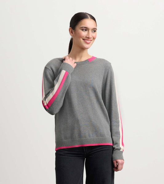 Charcoal sweater with contrast pink and cream stripes on sleeves, featuring a round neckline and relaxed fit.
