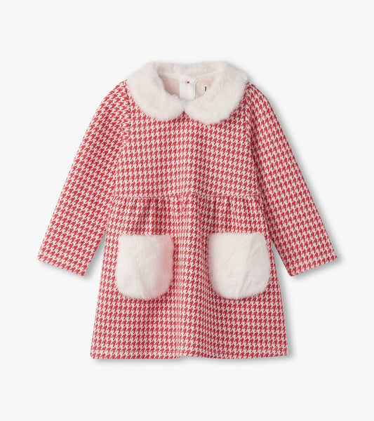 Red houndstooth dress with a white faux fur collar and pockets, designed for baby and toddler girls.