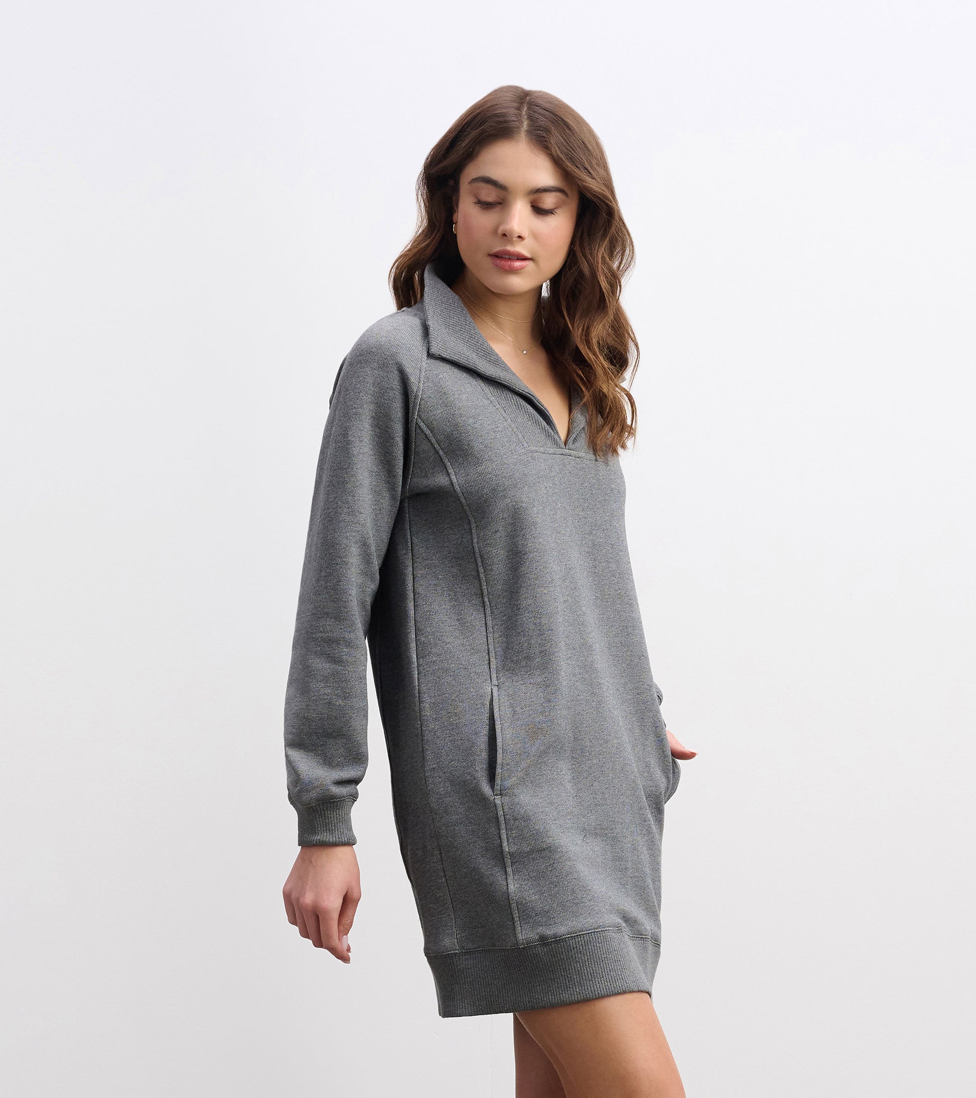 Charcoal melange dress with a notch neck, long sleeves, and side pockets, styled for a relaxed fit.