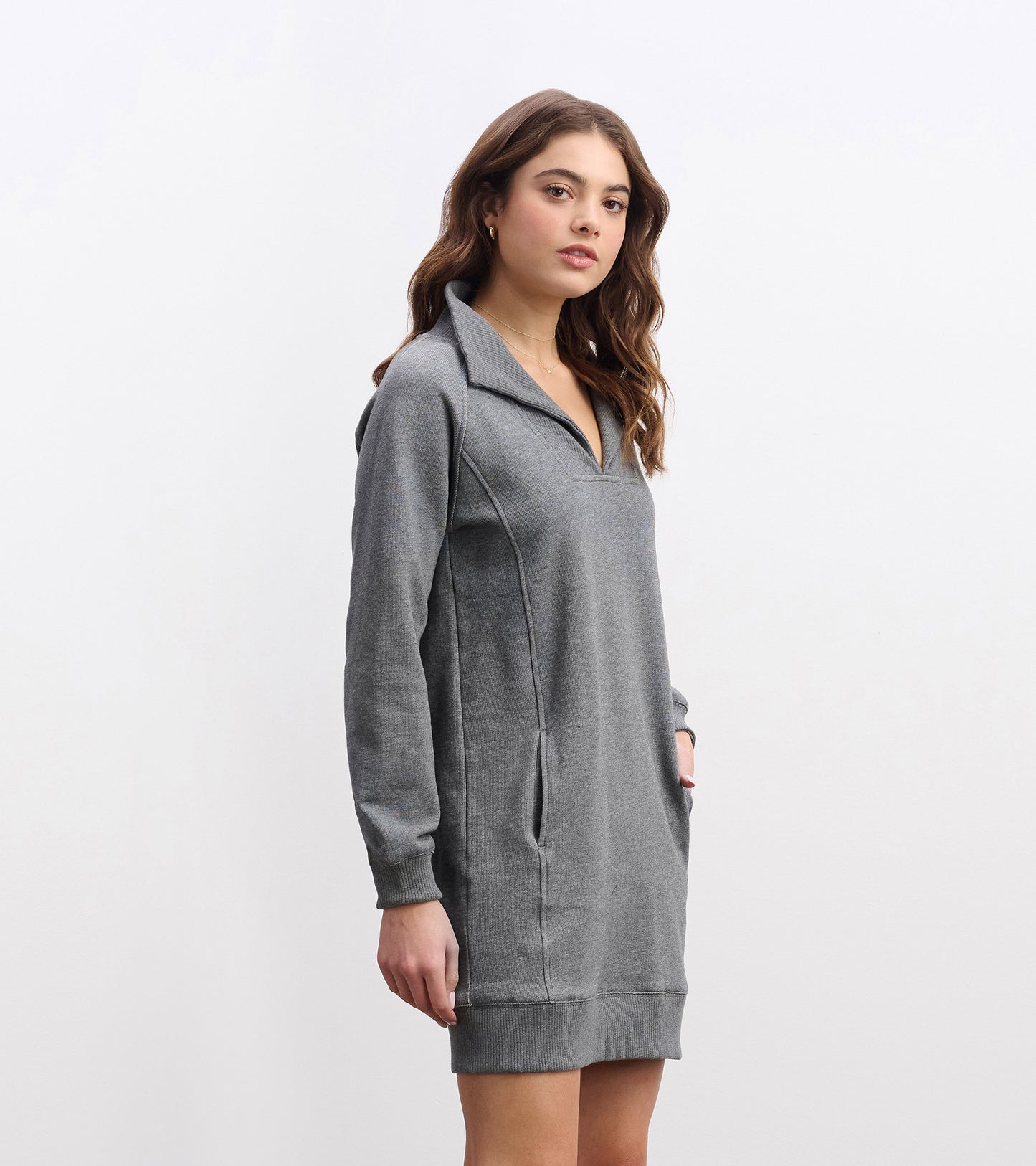 Charcoal melange dress with a notch neck, long sleeves, and side pockets, featuring a relaxed fit.