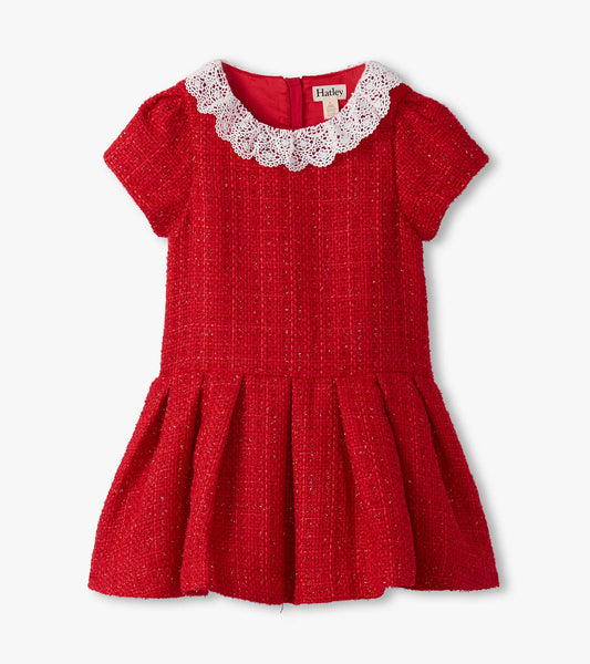 Red boucle dress with short sleeves and a pleated skirt, featuring a white lace collar.