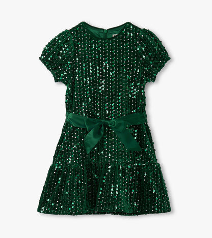Front view of green sequin dress with short puff sleeves, ribbon waist, and tiered skirt