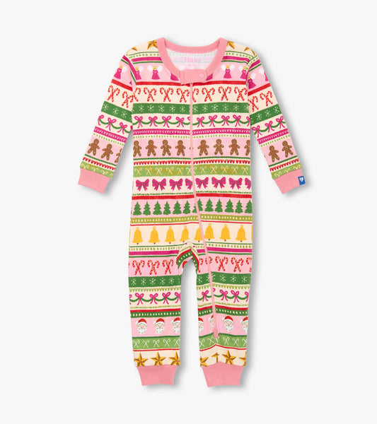 Pink cotton sleeper featuring a fun Fair Isle pattern with gingerbread men, Christmas trees, and festive motifs.