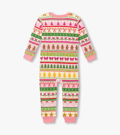 Pink cotton sleeper featuring a fun Fair Isle pattern with gingerbread, bows, trees, and festive elements.