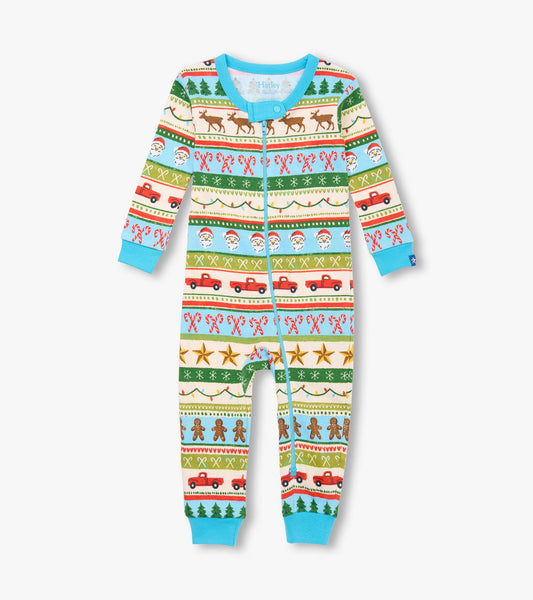 Blue cotton sleeper featuring a festive Fair Isle pattern with reindeer, Santa, and trucks, suitable for baby boys.