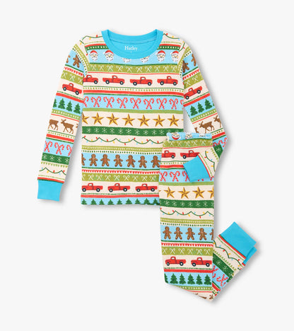 Blue cotton pajama set featuring a festive Fair Isle pattern with Santa, trees, and gingerbread men.