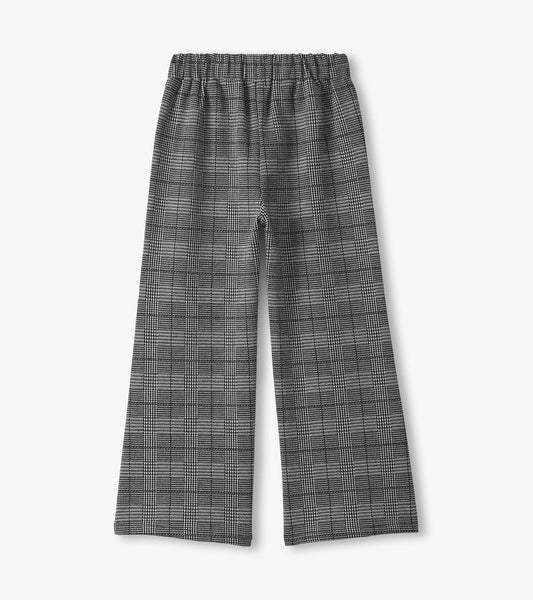 Black and white houndstooth plaid wide leg pants with an elastic waistband, suitable for casual wear.