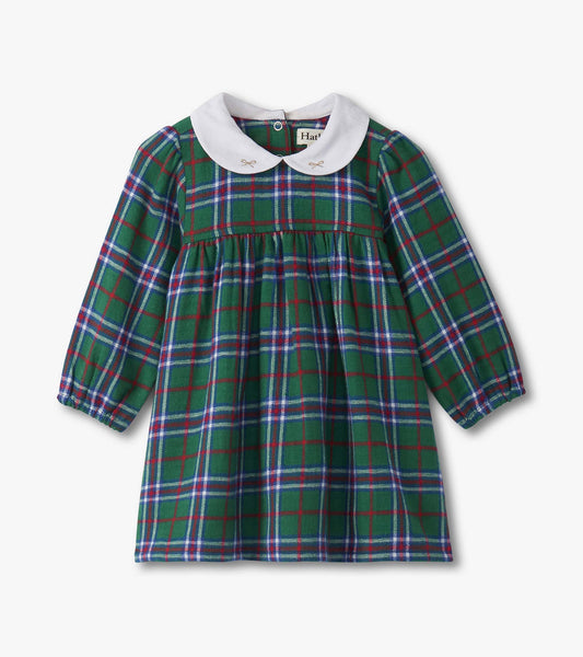Green plaid pinafore dress with puff sleeves and a white collar, featuring a gathered waist and button closure at the back.