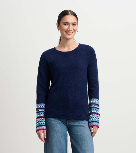 Navy sweater with textured body and colorful jacquard cuffs, featuring a round neckline and relaxed fit.