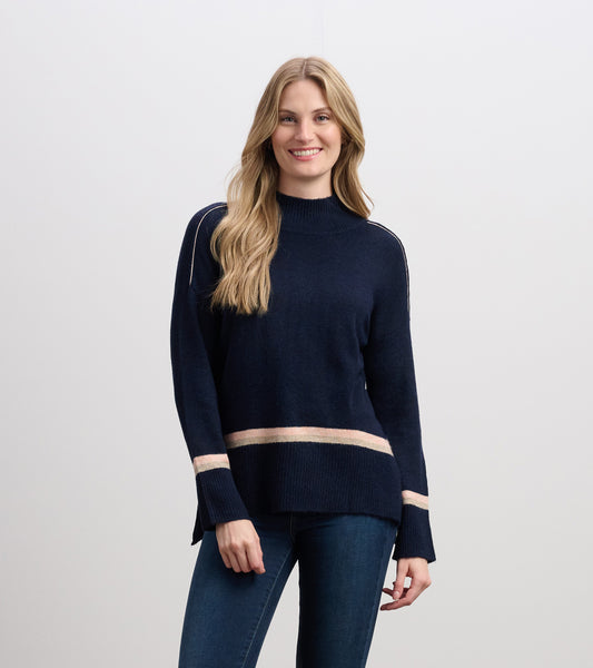 Navy mock neck sweater with light pink stripes at the hem and sleeves, featuring a relaxed fit and long sleeves.