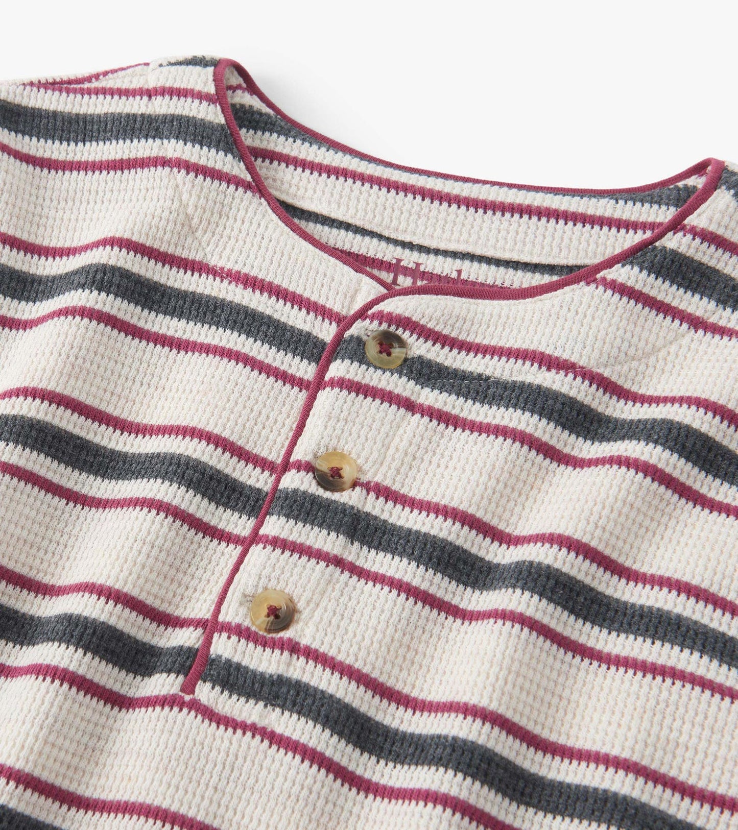 Oatmeal melange waffle henley with horizontal stripes in burgundy and navy, featuring a buttoned neckline.