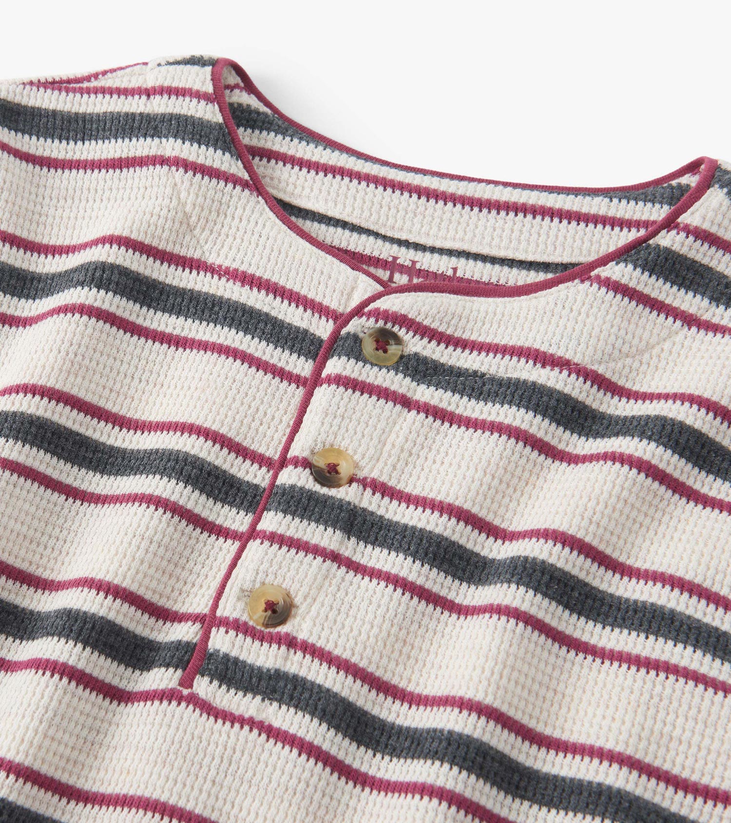 Oatmeal melange waffle henley with horizontal stripes in burgundy and navy, featuring a buttoned neckline.
