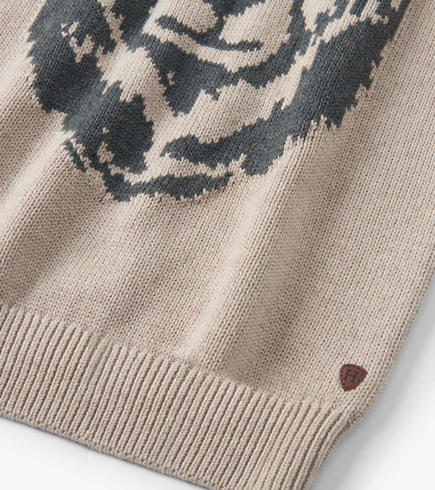 Oatmeal crew neck sweater featuring a bear design, ribbed hem, and soft knit material.