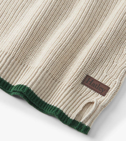 Oatmeal melange sweater with ribbed texture and green hem, featuring a button neck and side slit detail.