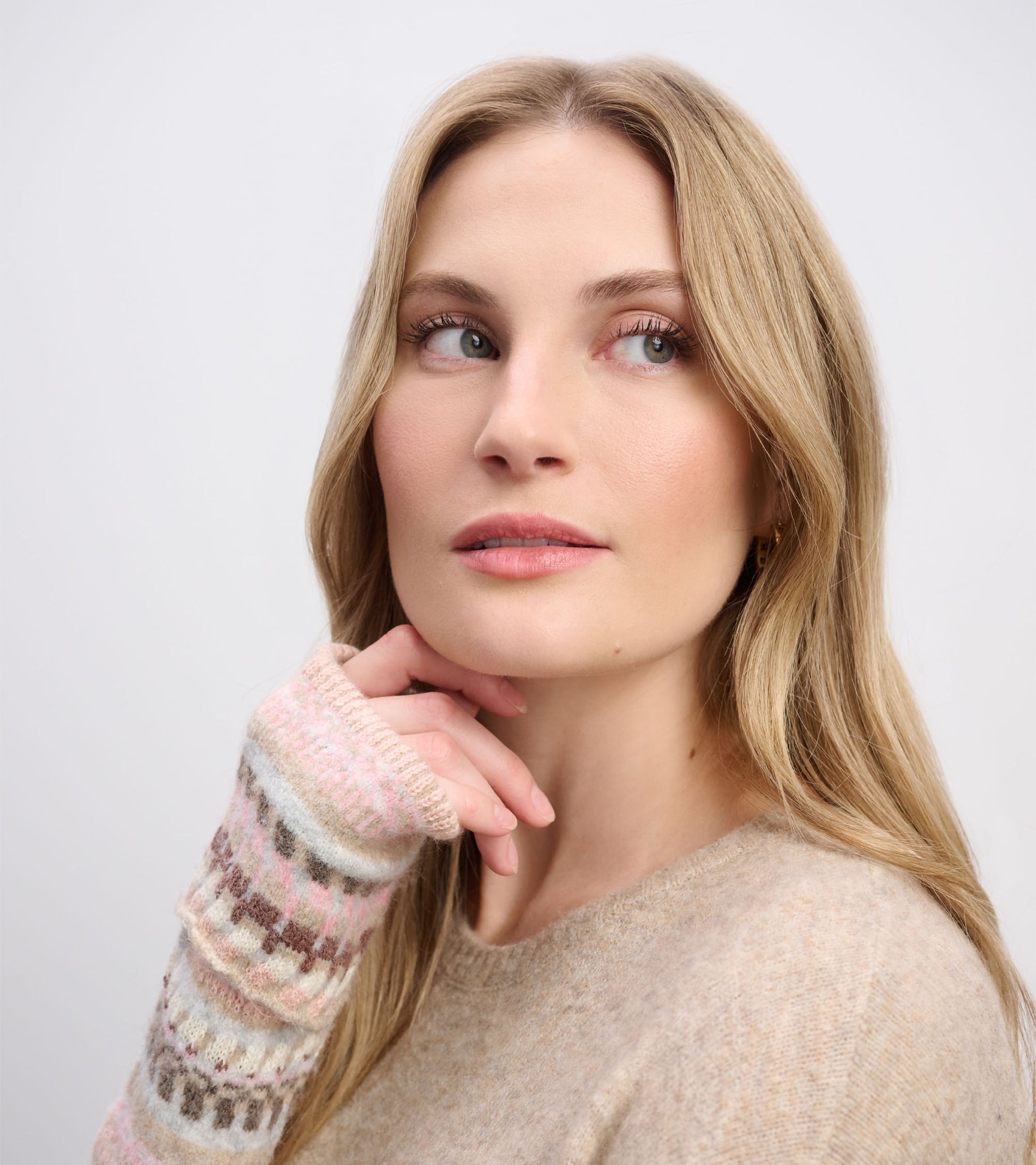 Oatmeal melange sweater dress with patterned sleeves, featuring soft knit fabric and a relaxed fit.