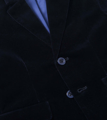 Navy velveteen blazer with a smooth texture, featuring two buttons and a notched collar.