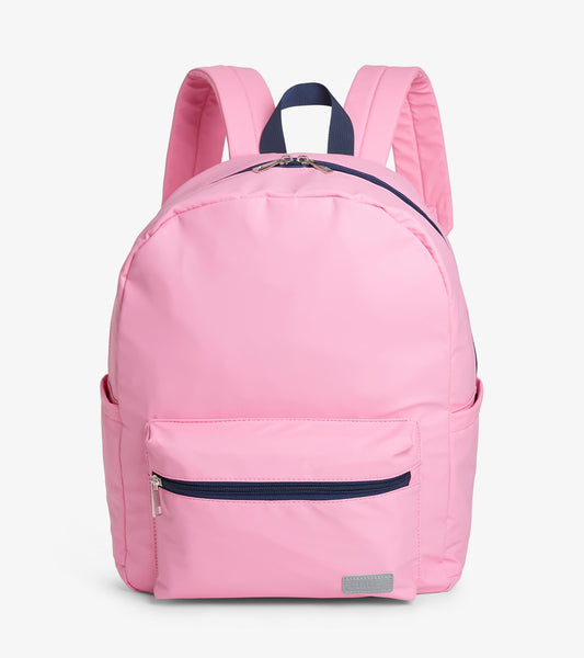 Pink backpack with front zip pocket, side pockets, padded straps, and navy top handle
