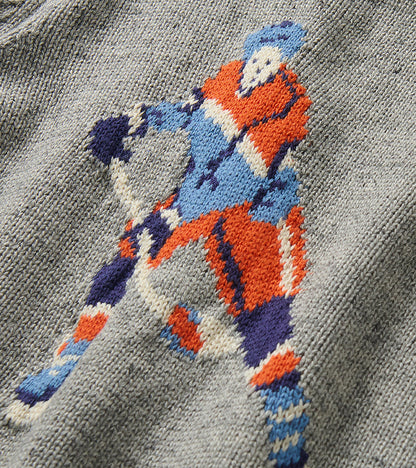 Close-up of the colorful hockey player knit detail on the heather gray sweater